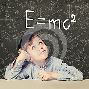 Student little boy and science background. Kid with science formulas