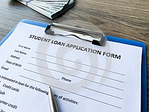 Student loan application form document on table