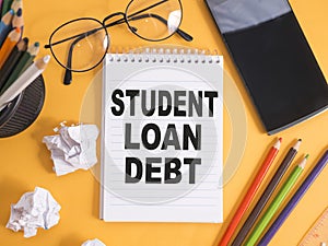 Student loan debt, text words typography written on paper, life and educational