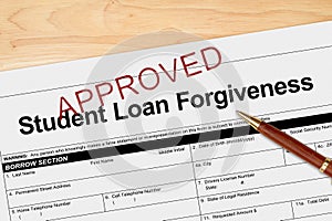 Student Loan Forgiveness application approved with pen