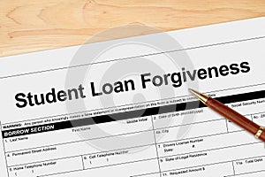 Student Loan Forgiveness application with pen