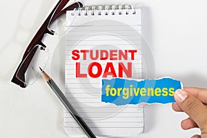 Student loan forgiveness, text words typography written on paper, life and educational