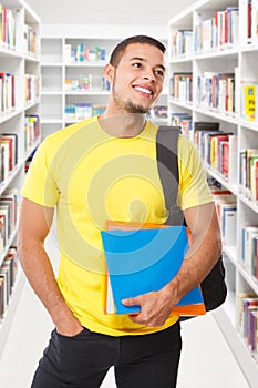 Student looking up look library books portrait format smiling happy young man people