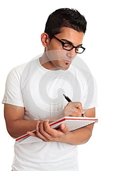 Student or man wearing glasses writing