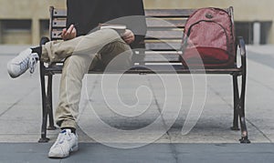 Student man writing diary chilling on bench