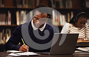 Student, man and writing in library for studying, research and planning in university, scholarship and education