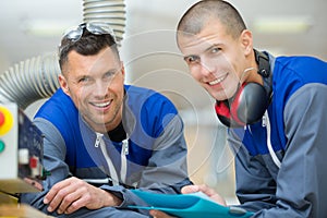 student and mentor in workshop factory