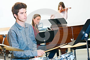 student in music class
