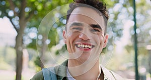Student, nature and face of young man laughing in outdoor park at university for studying. Happy, education and portrait