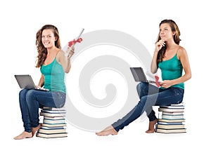 The student with netbook sitting on books