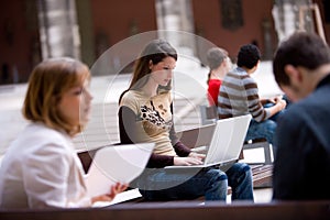 Student outdoor with laptop pc photo