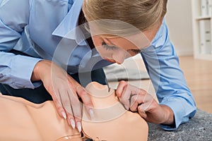 Student Performing Cpr Technique On Dummy