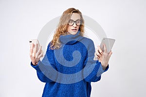 Student with phone and tablet