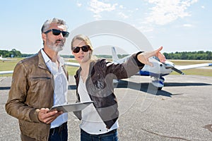 student pilot and instructor going through pre-flight pilot checklist