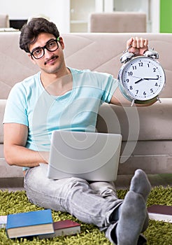 Student preparing for university exams at home in time managemen