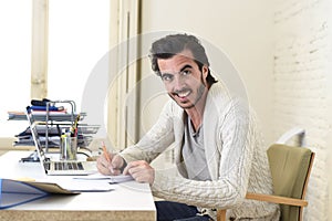 Student preparing university project or hipster style freelancer businessman working with laptop