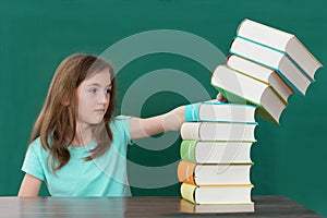 Student Pushing Stack Of Books