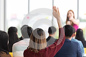 Student Raising Hand Up in a classroom.