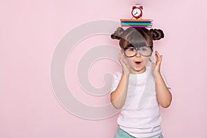 Student ready for school. Children`s Stationery for school. Kid with notebook and pen in hands.