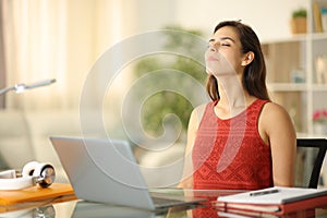 Student relaxing breathing relieving stress at home