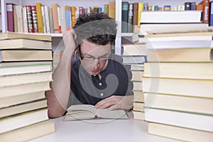 Student researching with books in a library photo