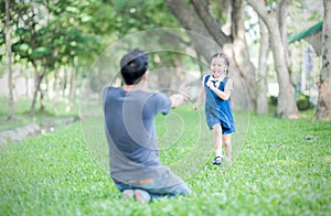 Student running into father& x27;s hands to hug