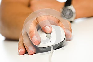 Student's hand using computer mouse