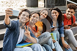 Student& x27;s Selfie. Multiethnic group of college friends taking photo together on smartphone