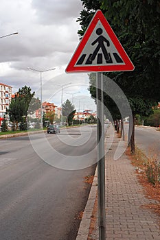 Student school crossing sign on the vehicle road