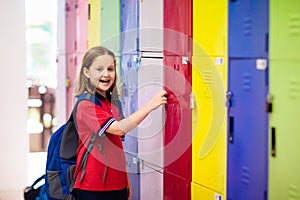 Student in school at locker. Kids in preschool