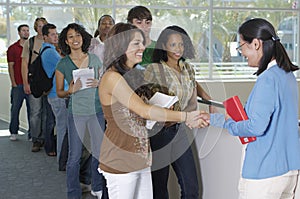 Student Shaking Hands With Teacher