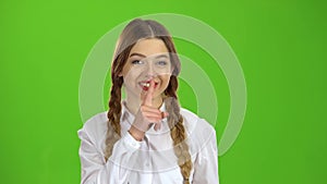 Student shows a gesture quieter. Green screen