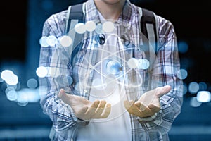 Student shows hands atom .