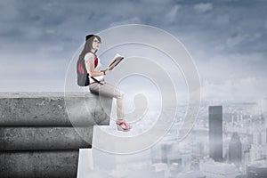 Student sitting on the rooftop