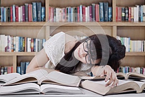 Student sleeping and dreaming in the library