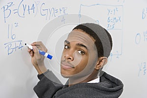 Student Solving Algebra Equation On Whiteboard