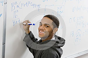 Student Solving Algebra Equation On Whiteboard