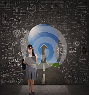 Student standing on a chance door