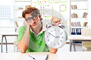 The student struggling at the exam in classroom