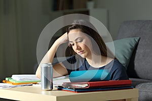 Student studying hard in the night at home