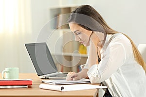 Student studying at home memorizing notes photo