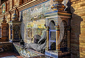 Siesta in the sun at the Plaza de Espana in Seville, Spain.