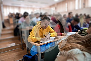 student taking notes while studying in high school