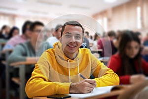 student taking notes while studying in high school