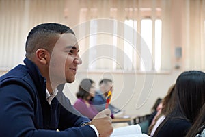 student taking notes while studying in high school