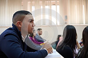 student taking notes while studying in high school