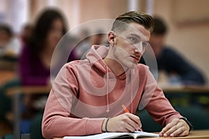 student taking notes while studying in high school