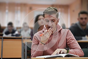 student taking notes while studying in high school