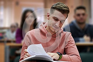 student taking notes while studying in high school