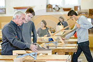 student and teacher in carpentry class